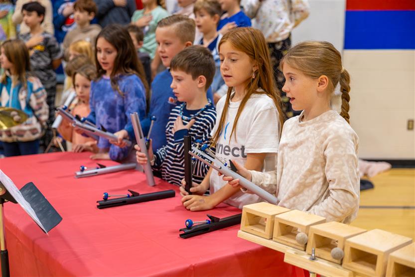 Students play instruments